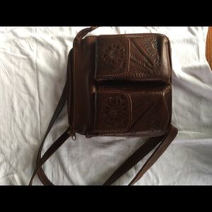 Hand tooled all leather adjustable strap handbag